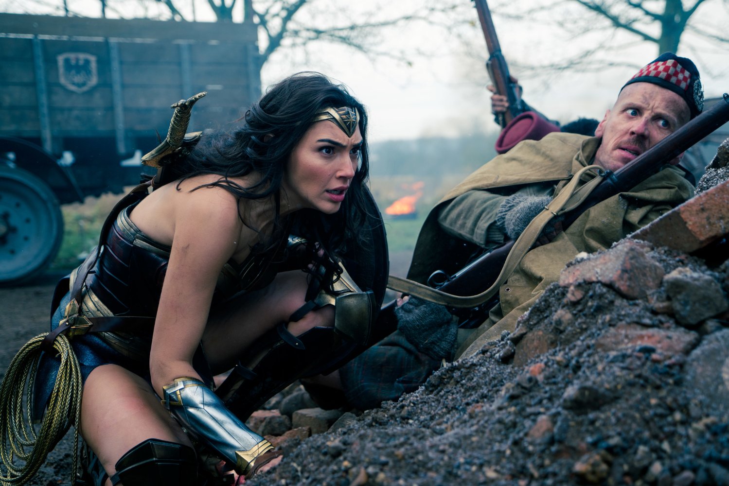 An action scene from Wonder Woman, with Wonder Woman and another character shown in muted colors